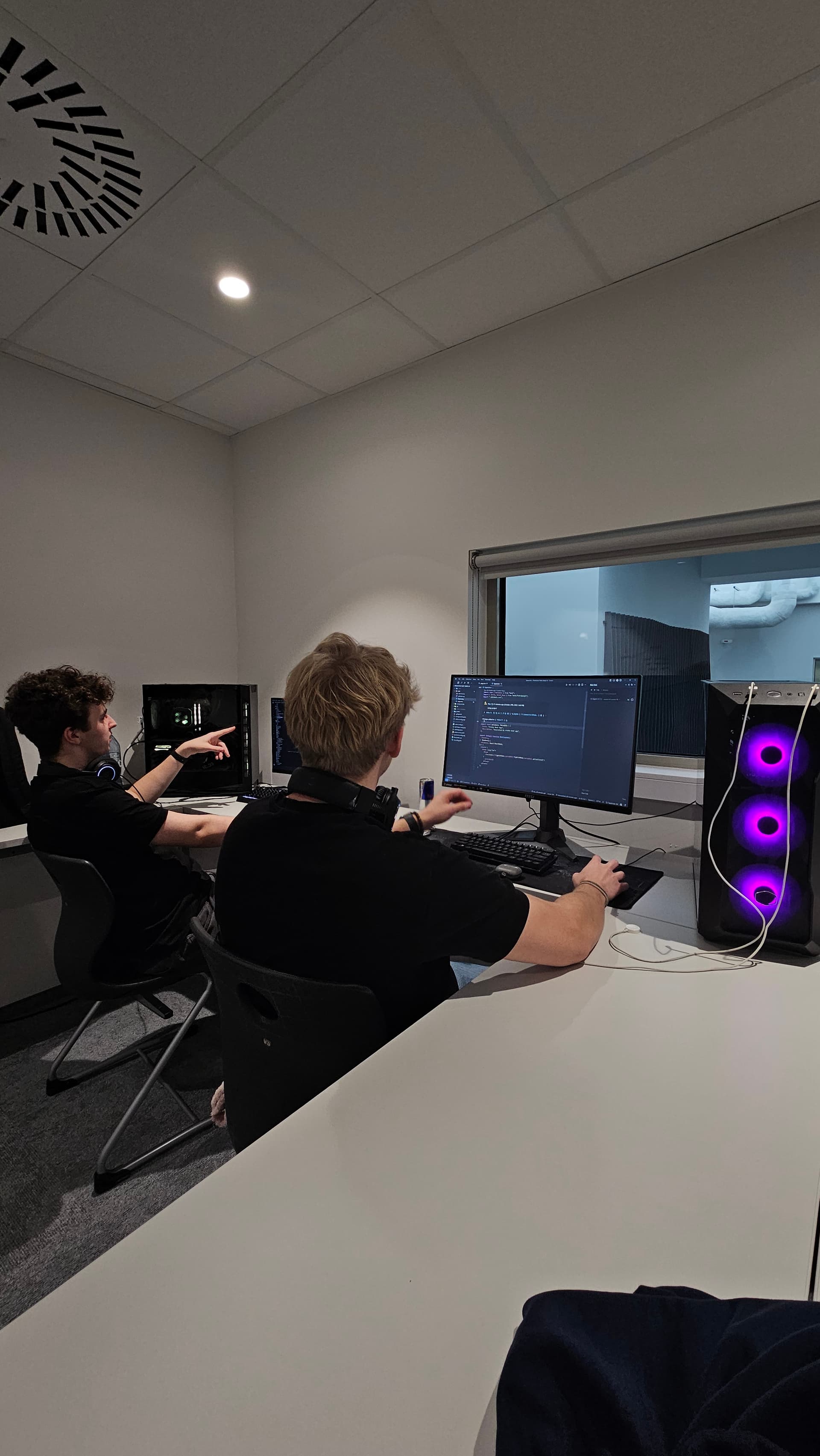 Kamil Leśkiewicz working on hackathon project - coding and development during competition